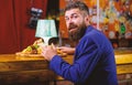 Restaurant client. Hipster formal suit sit at bar counter. Man received meal with fried potato fish sticks meat