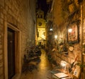 Restaurant, coffee place, winery in the center of Sibenik town, outside seating in a small narrow street with a church
