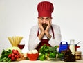 Restaurant cuisine concept. Chef prepares meal. Man with beard