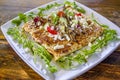 Fresh, enticing Greek Mediterranean style crepe with tomatoes, cucumbers, onion, feta cheese, & arugula.