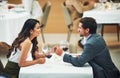 Restaurant, date and couple holding hands with wine for romantic dinner, relax and anniversary celebration. Relationship