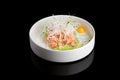 Restaurant dish - shrimp tartare with avocado, cream cheese, sweet chilli sauce on white plate Royalty Free Stock Photo