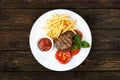 Restaurant food - beef grilled steak with french fries Royalty Free Stock Photo