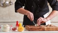 Restaurant hotel private chef cutting mushrooms on board