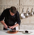 Restaurant hotel private chef preparing dessert chocolate cake Royalty Free Stock Photo