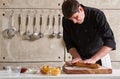 Restaurant hotel private chef preparing pizza rolling flattening