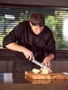 Restaurant hotel private chef slicing fresh loaf of bread Royalty Free Stock Photo