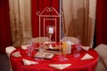 Restaurant interior -A table decorated with a red tablecloth in the restaurant Royalty Free Stock Photo