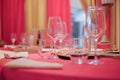 Restaurant interior -A table decorated with a red tablecloth in Royalty Free Stock Photo