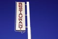 Restaurant light text sign on blue summer sky