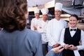 Restaurant manager briefing to his kitchen staff Royalty Free Stock Photo