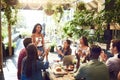 Restaurant, meeting and woman with business people applause for lunch discussion, planning and presentation. Cafe Royalty Free Stock Photo