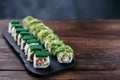 Appetizing sushi rolls set served on wooden tray Royalty Free Stock Photo