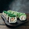Sushi rolls set served on wooden tray, free space Royalty Free Stock Photo