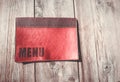 Restaurant menu on a wood table Royalty Free Stock Photo