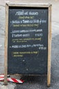 A restaurant menu written on a blackboard