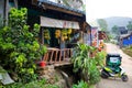 A restaurant near the road sells fresh bananas and pineapples