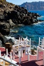 Restaurant near rocky cliffs at the sunlit seascape on a sunny morning