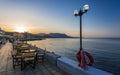 Restaurant at Paraliaki promenaad at sunset in Kissamos, Crete, Greek Islands, Greece, Europe Royalty Free Stock Photo