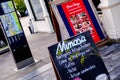 Restaurant Pavement Advertising Boards Attracting Customers