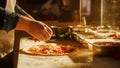 In Restaurant Professional Chef Preparing Pizza, Adding Ingredients, Olive Oil, Special Sauce Royalty Free Stock Photo