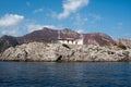 Restaurant in a remote location on mountain rock in the sea. Rock Restaurant over the sea.