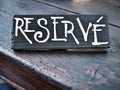 Restaurant reserved table sign on wooden table