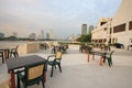 Restaurant seats and tables near the river, restaurant interior.