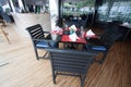 Restaurant seats and tables near the river, restaurant interior.