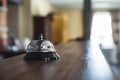 Restaurant Service Bell on the Table in Hotel Reception - Vinta Royalty Free Stock Photo