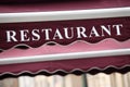 French restaurant canopy sidewalk cafe sign Paris France Royalty Free Stock Photo