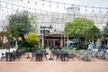 Restaurant table and chairs settings in outdoor dinning area during coronavirus restrictions waiting to reopen