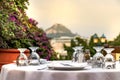 Restaurant table with glasses and tableclothe at a Greek tavern - restaurant in Plaka, Athens. Royalty Free Stock Photo