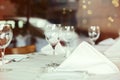 Restaurant table setting with wine glass. Selective focus on wine glass Royalty Free Stock Photo