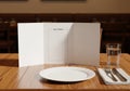 A restaurant table setup with a wooden surface, featuring an empty white plate, a folded white Royalty Free Stock Photo
