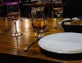 restaurant table with wine carafe and glasses with garlic bread in a little basket as an appetizer Royalty Free Stock Photo
