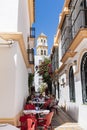 Restaurant tables in narrow alley Marbella old town Royalty Free Stock Photo
