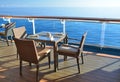 Restaurant tables on the open deck of cruise ship Royalty Free Stock Photo