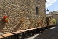 Restaurant tables at Plaza Mayor, in Ainsa, Huesca, Spain in Pyrenees Mountains, an old walled town with hilltop views of Cinca an Royalty Free Stock Photo