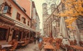 Restaurant tables, stores and 15th century Frauenkirche church Royalty Free Stock Photo