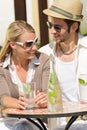 Restaurant terrace elegant couple drink sunny day Royalty Free Stock Photo