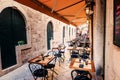 Restaurant terrace in the old town of Dubrovnik in the narrow street