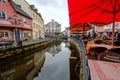 Restaurant terraces along the river Saar in the center of Saarburg, Germany