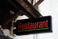 Restaurant text sign on facade building cafe pub in street