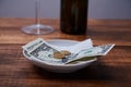 Restaurant tips or gratuity. Banknotes and coins on a plate Royalty Free Stock Photo