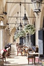 Restaurant under the arches of Cloth Hall, Krakow, Poland