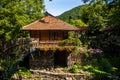 Restaurant in a vintage yard with wooden house, beautiful garden and much retro details