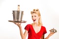 Restaurant waiter with champagne. Pinup girl with service tray. Serving presentation concept.
