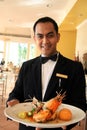 Restaurant waiter holding food