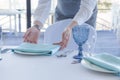 Restaurant waiter serves a table for a wedding celebration Royalty Free Stock Photo